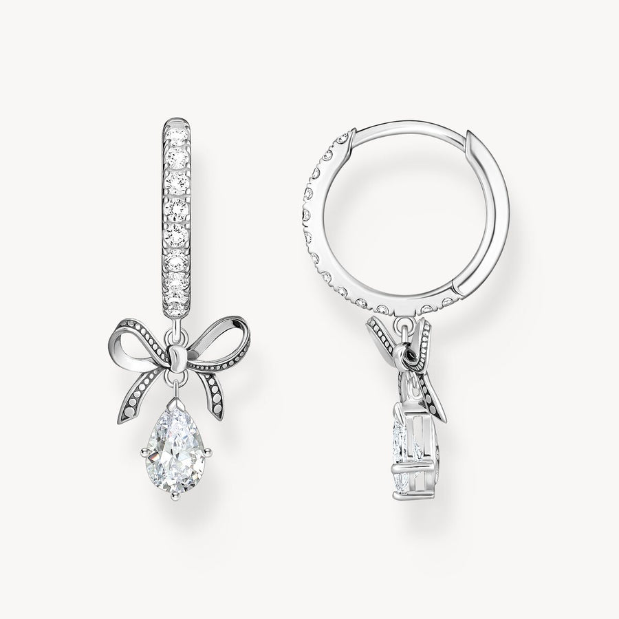 Silver hoop earrings with bow pendant